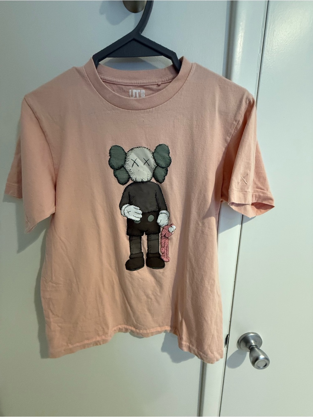 KAWS Uniqlo Pink Graphic Tee with Character Print